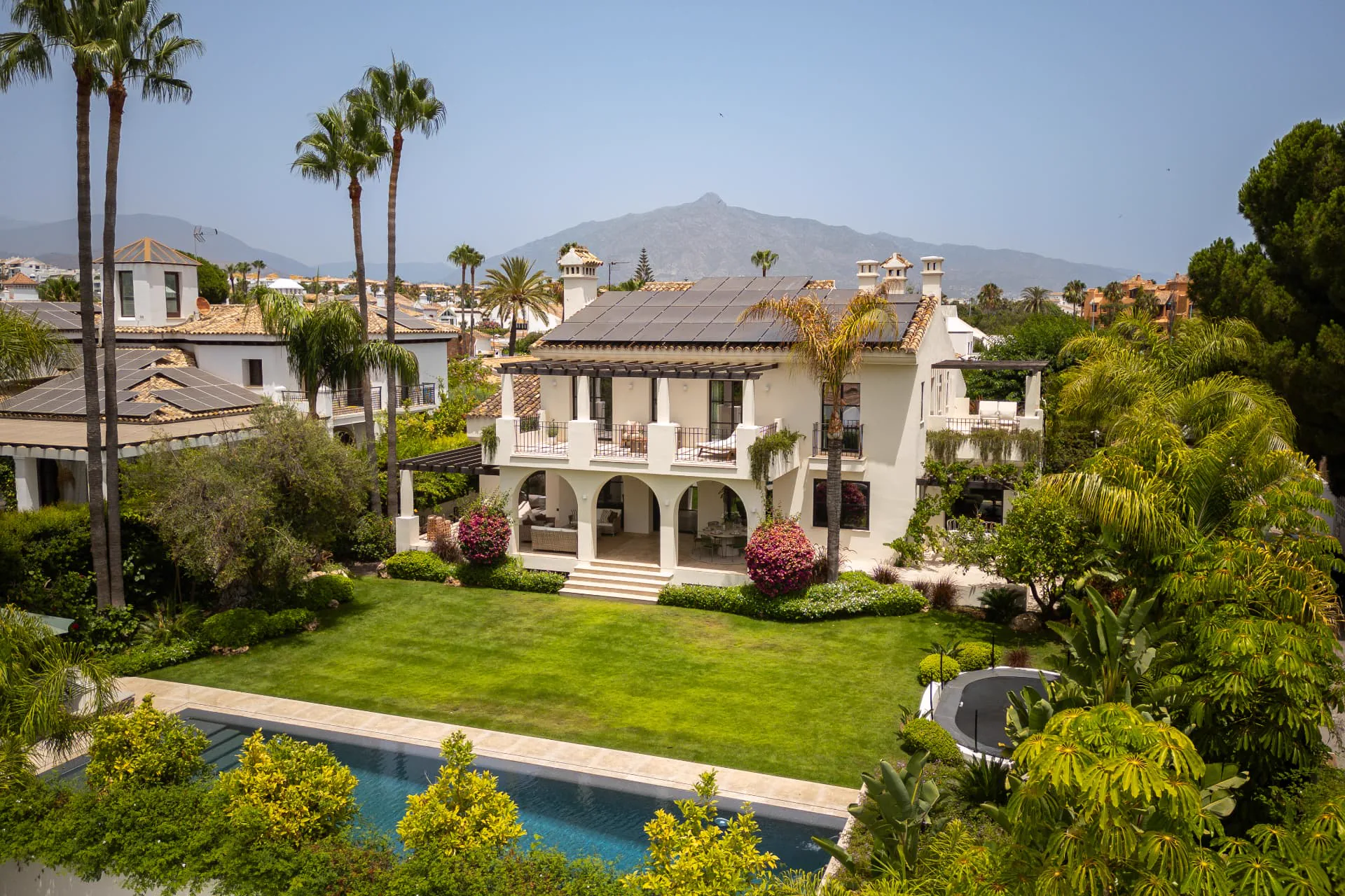 La Serena from above, its gardens framed by palms with La Concha beyond